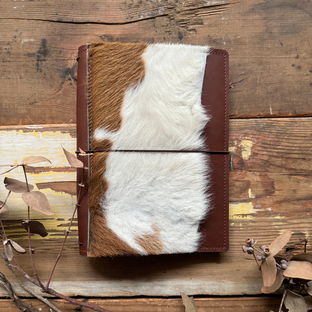 The 'Wild Wedge Tailed Eagle' TN Leather Journal in Wild Brown with Tan + White Cowhide